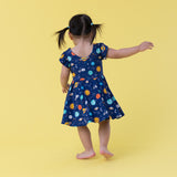 Macaron + Me Flutter Sleeve Swing Dress - Peaceful Planets - Let Them Be Little, A Baby & Children's Clothing Boutique
