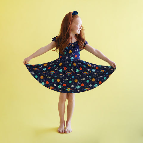 Macaron + Me Flutter Sleeve Swing Dress - Peaceful Planets - Let Them Be Little, A Baby & Children's Clothing Boutique